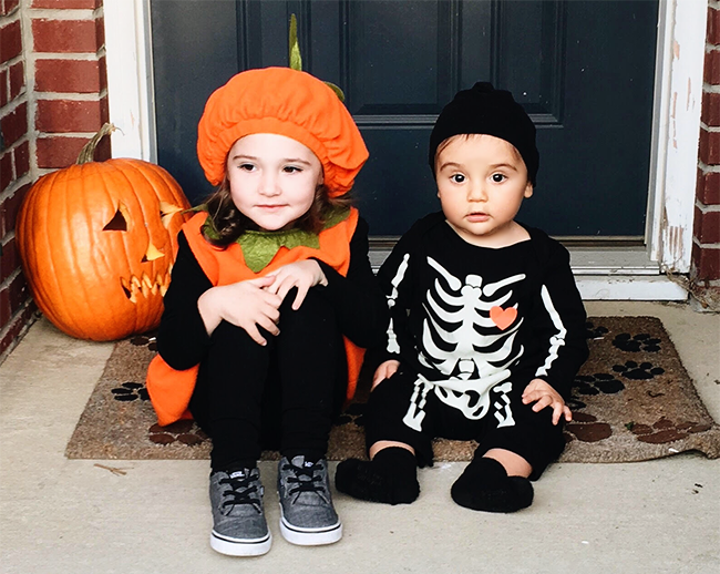 Two kids in Halloween costumes