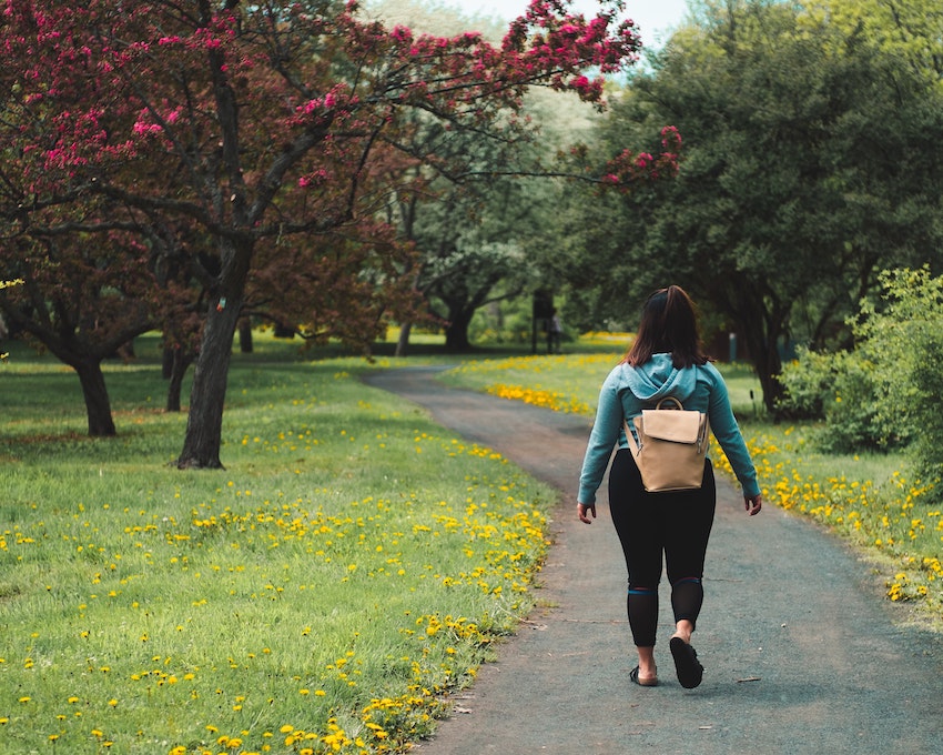woman walking with backpack