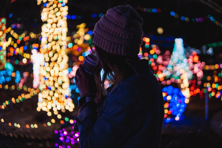 christmas lights woman in beanie