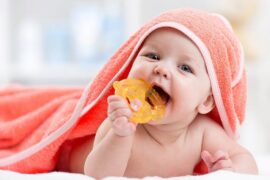 Teething baby in a towel