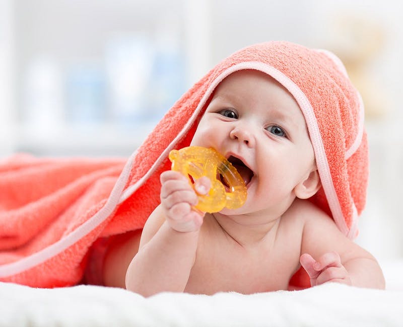 Teething baby in a towel